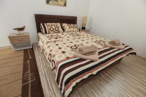 Cama ou camas em um quarto em Apartman Luka