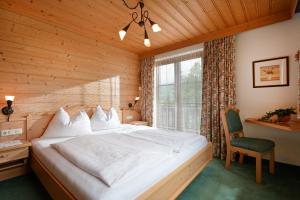 Un pat sau paturi într-o cameră la Haus Oswald