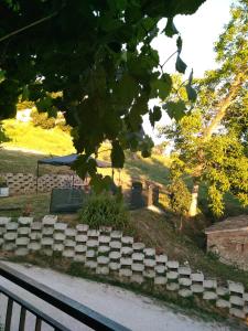a bunch of graves in a park with a bench at CAMPO BASE B&B in SantʼAngelo in Pontano