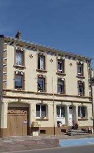 a large building with a garage in front of it at Bienvenue Chez Nous in Clouange