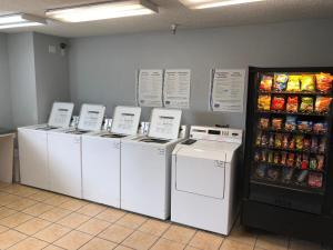 a row of washers and dryers in a store at InTown Suites Extended Stay Salt Lake City UT - Midvale in Midvale