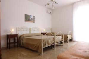 Ein Bett oder Betten in einem Zimmer der Unterkunft Don Nicola Residence