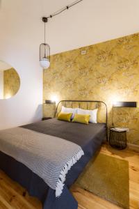 Łóżko lub łóżka w pokoju w obiekcie House Apartments Centrum Poznań
