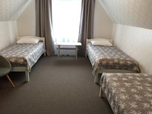 Кровать или кровати в номере Tiigi Accommodation