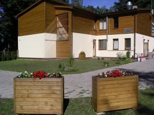 two flower boxes in front of a building at KEMERI Hotel in National Park - FREE PARKING in Jūrmala