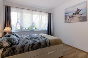 Posteľ alebo postele v izbe v ubytovaní Praia Apartments - 200m do Plaży Orłowo - Parking - Apartament Laguna
