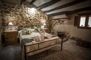 Postel nebo postele na pokoji v ubytování Casa Rural "El Olivo"