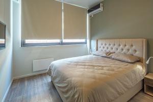 A bed or beds in a room at THE apartment 2 BDRS/2 BATHS luxury residence