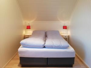 Säng eller sängar i ett rum på Lofotveggen Panorama