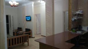 a living room with a table and a couch at Al-Madina Tower Apartments in Marsa Matruh