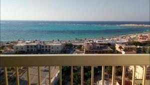 a view of the ocean from the balcony of a condo at Al-Madina Tower Apartments in Marsa Matruh