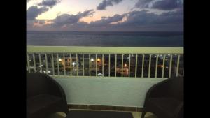a view of the ocean from the balcony of a resort at Al-Madina Tower Apartments in Marsa Matruh