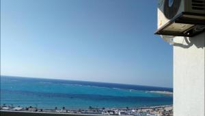 a view of the ocean from a building at Al-Madina Tower Apartments in Marsa Matruh