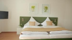 Postel nebo postele na pokoji v ubytování Hotel Barbara
