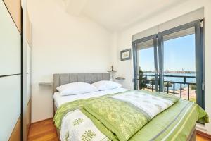 Ein Bett oder Betten in einem Zimmer der Unterkunft Apartment Bellavista Sea View
