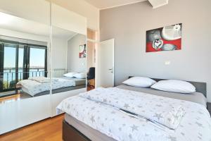 Ein Bett oder Betten in einem Zimmer der Unterkunft Apartment Bellavista Sea View