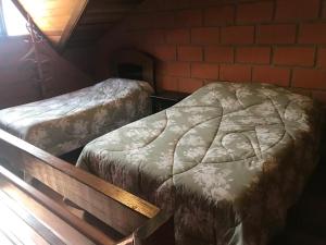 Cama o camas de una habitación en Chalé da Lu