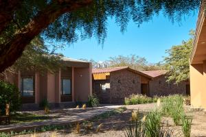 a house in the middle of a yard at Hotel La Casa de Don Tomás in San Pedro de Atacama