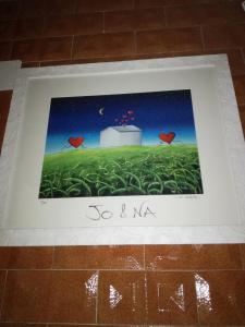 a picture frame with a picture of a field with hearts at JO & NA in Lanciano
