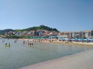 a group of people in the water at a beach at JO & NA in Lanciano