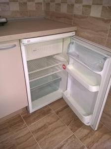 Kuchyň nebo kuchyňský kout v ubytování Apartmani Mimi