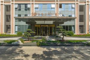 a building with a balcony on top of it at Sincere Residence Changfeng - Changfeng Ecological Business District - Near Exit 3 of Changfeng Park Station on Subway Line 15 in Shanghai