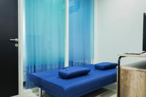 Ένα ή περισσότερα κρεβάτια σε δωμάτιο στο Modern Living 1BR @Atlanta Residences Apartment With City View By Travelio +11 φωτογραφίες