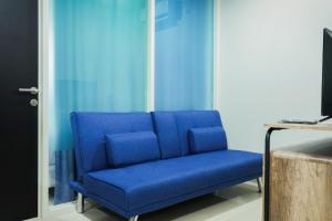 Μια τηλεόραση ή/και κέντρο ψυχαγωγίας στο Modern Living 1BR @Atlanta Residences Apartment With City View By Travelio