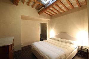 En eller flere senger på et rom på Villa Leonardo