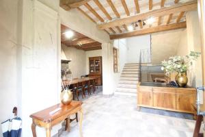 a large kitchen with a table and a dining room at Villa Leonardo in Vinci
