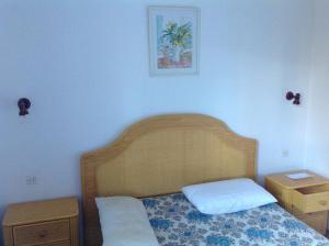 Postel nebo postele na pokoji v ubytování Apartament Turístic Alhambra