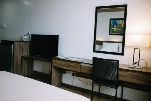TV a/nebo společenská místnost v ubytování Leope Hotel