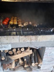 a grill with a bunch of food on it at IRIS B&B in DEBED CANYON in Alaverdi