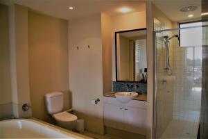 A bathroom at Marine Boutique Apartments by Kingscliff Accommodation
