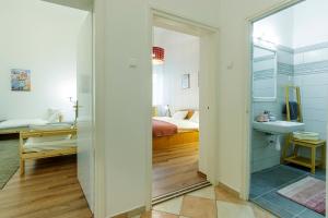 Postel nebo postele na pokoji v ubytování SOPHIE Apartman