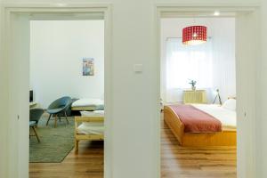Postel nebo postele na pokoji v ubytování SOPHIE Apartman