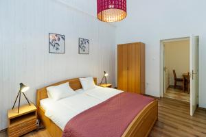 Postel nebo postele na pokoji v ubytování SOPHIE Apartman