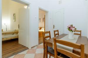 Postel nebo postele na pokoji v ubytování SOPHIE Apartman