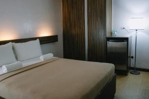 Postel nebo postele na pokoji v ubytování Leope Hotel