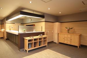 a large kitchen with a counter and a sink at Hotel Nature Nagoya Sakae Kishu Railway Group in Nagoya