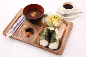 a tray with sushi and a cup of coffee and a plate of food at Hotel Nature Nagoya Sakae Kishu Railway Group in Nagoya +31 photos