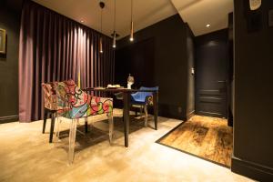 a dining room with a table and chairs at HOTEL SHIKISAI KYOTO in Kyoto