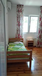 Giường trong phòng chung tại Villa Nadija