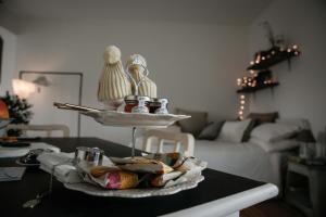a table with a tray of food on top of it at Attico&Nuvole in Turin