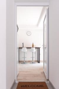 an open hallway with a table and chairs in a house at Demix in Koper