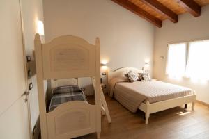Tempat tidur dalam kamar di B&B La Torretta
