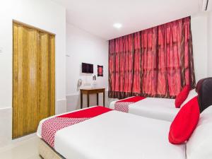 Ένα ή περισσότερα κρεβάτια σε δωμάτιο στο Super OYO 414 Adiff Palace Hotel