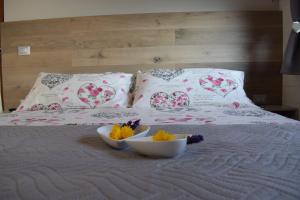 Postel nebo postele na pokoji v ubytování 2 CUORI E UN B&B