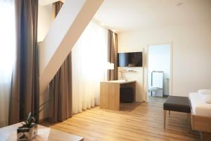 TV a/nebo společenská místnost v ubytování Flair Hotel Grüner Baum