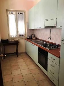 Køkken eller tekøkken på Giardino - Poggio del Casale - Affittacamere - landlords